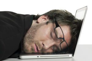 businessman sleeping on his laptop